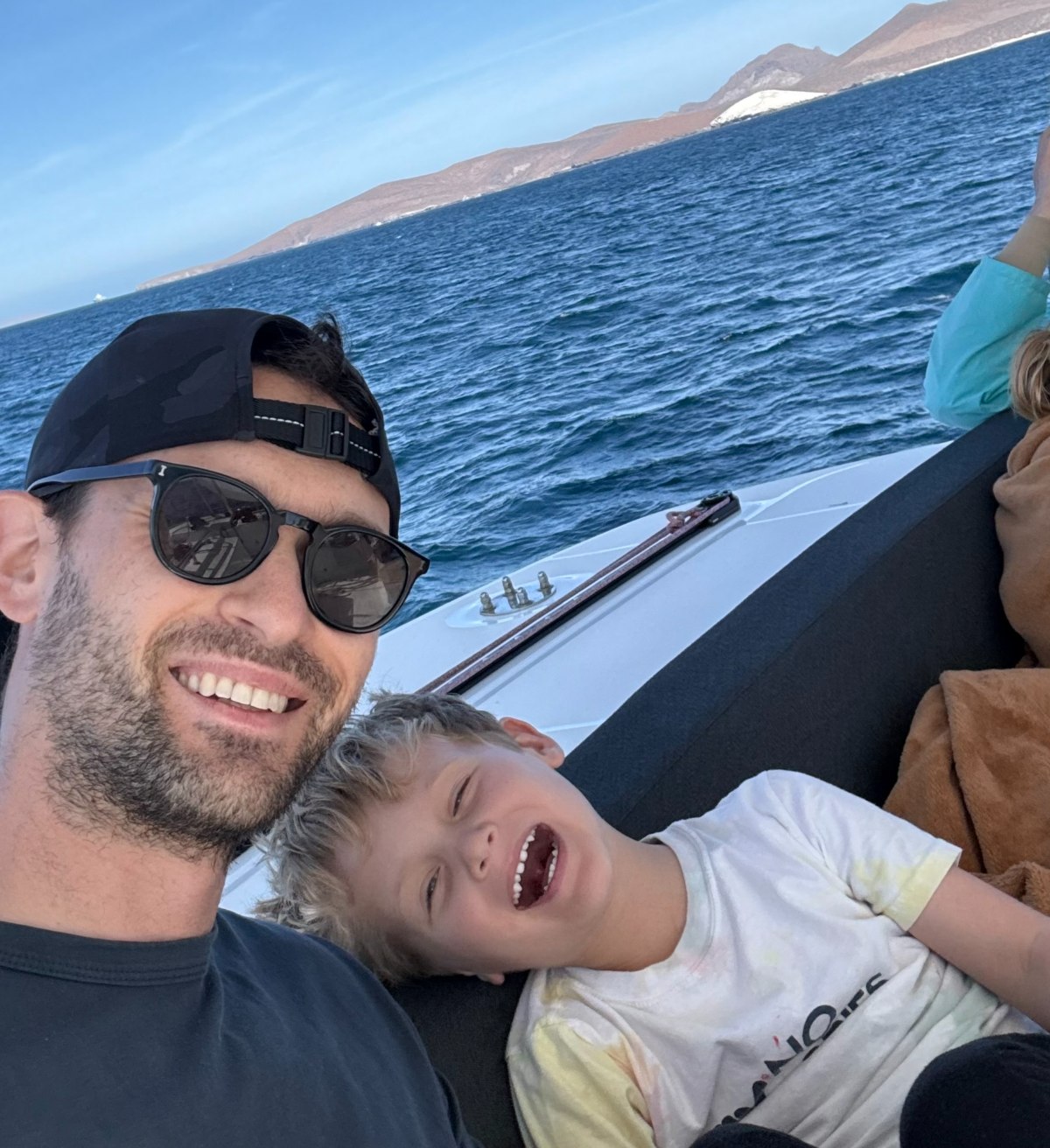 Adam and his son on a boat in the Sea of Cortez